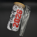 Glass jar with 'Class of 2026' text on a dark background